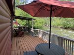 Deck living right on the creek at the Fishing Cabin